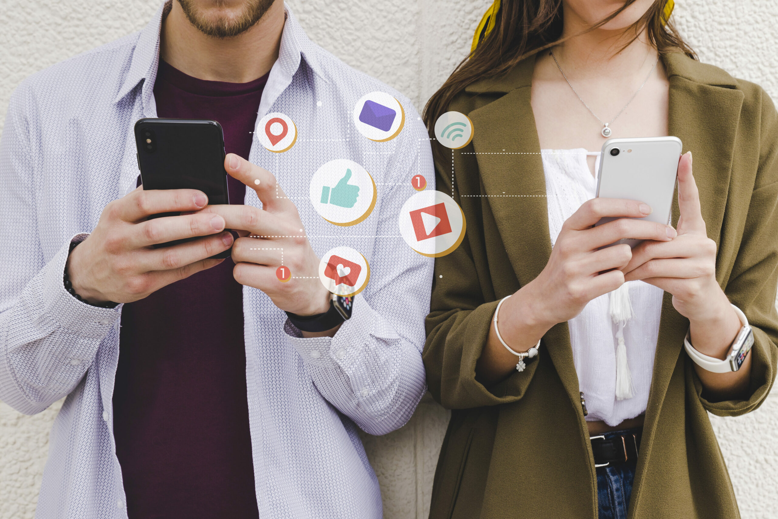 Two people holding cell phones with social media icons indicating social media use